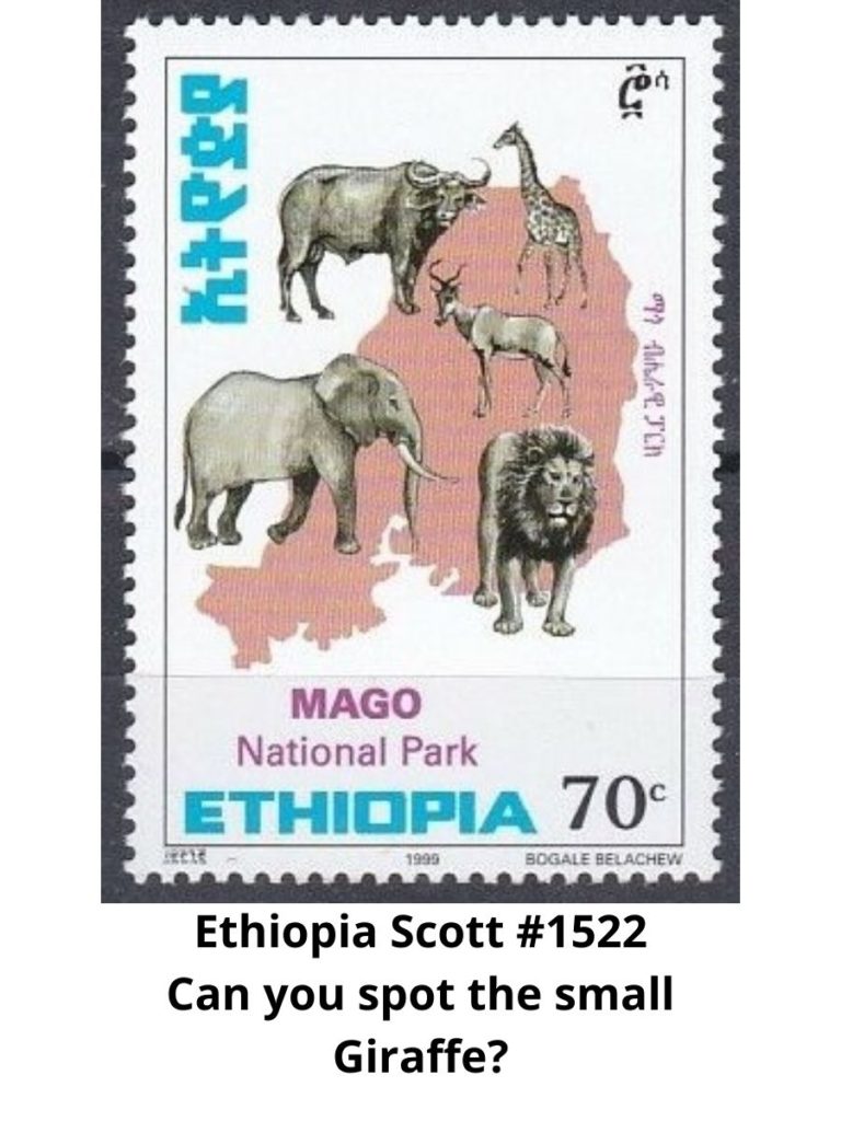 Postage Stamp with many mammals including a giraffe on it